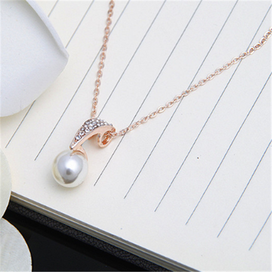 Rose gold-toned necklace and stud earrings set with faux pearls and clear rhinestones, displayed on a white background. - Image 4