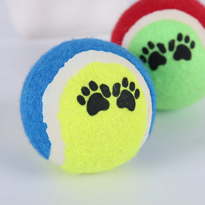 Red and green pet tennis ball with black paw print graphics, a durable rubber dog toy for fetch. - Image 4