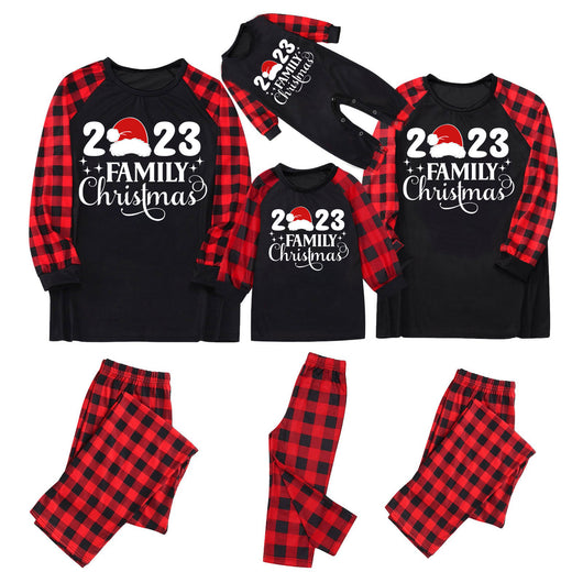 Red and black buffalo plaid Christmas pajama set with a long-sleeve top and matching pants. Top reads "2023 FAMILY Christmas". - Image 15