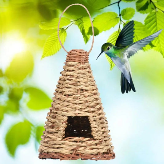 Cone-shaped, flat-bottomed bird's nest woven from natural straw with a small entrance and hanging loop.