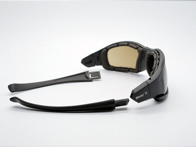Black full-frame motorcycle goggles with yellow lenses, an adjustable elastic strap, and detachable temple arms. - Image 6