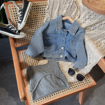 Woman and child in matching outfits: light blue denim jackets and dark gray knitted mini dresses, with baseball caps and sneakers. - Image 5