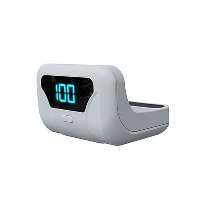 White portable battery pack with digital display attached to a PS5 controller, showing 100% charge. - Image 10