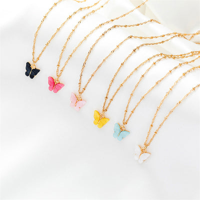 Pink acrylic butterfly necklace and earring set with gold-colored chain and hoop earrings. - Image 16