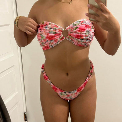Floral print tube top bikini with blue and purple flowers, white lace trim, and a central ring detail.