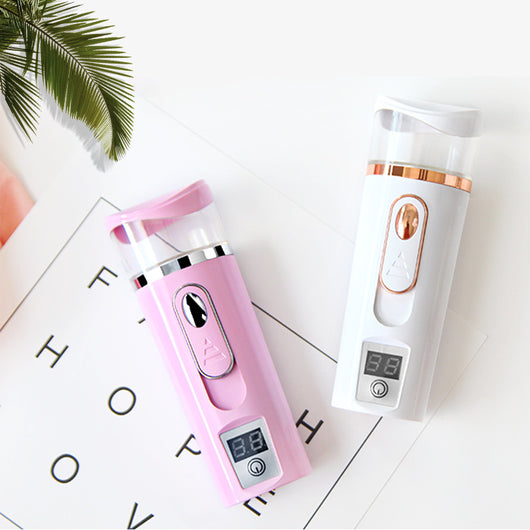 White and rose gold nano spray water meter with a clear tank, digital display, and power button. - Image 15