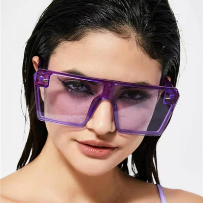 Oversized flat-top sunglasses with translucent red plastic frames and matching red lenses on a white background. - Image 3