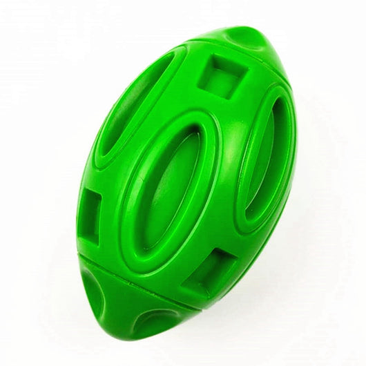 Green rubber rugby-shaped dog toy with textured surface and cut-outs, designed for chewing and play. - Image 18