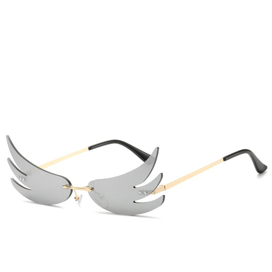 Rimless flame-shaped sunglasses with silver reflective lenses, gold metal temples, and black temple tips. - Image 6