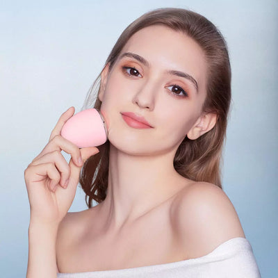 Yellow egg-shaped iontophoresis beauty instrument with a silver base and a power button on a white background. - Image 6