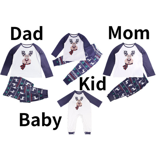 White and navy blue baby romper with a reindeer graphic wearing a red plaid scarf, featuring long raglan sleeves and snap closures.