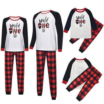 White long-sleeve pajama top with "wild one" graphic and red and black plaid pants. - Image 4