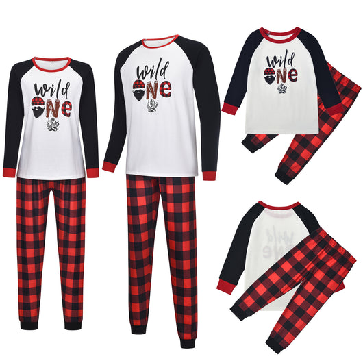 White long-sleeve pajama top with "wild one" graphic and red and black plaid pants. - Image 4