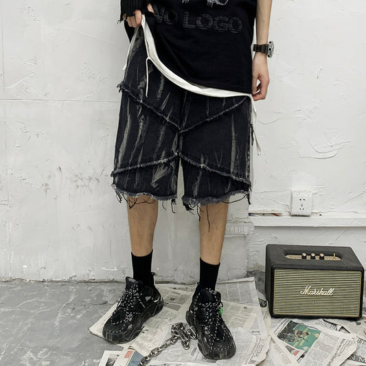 Shorts de Mezclilla Oscura con Estampado Tie-Dye y Bordes Deshilachados