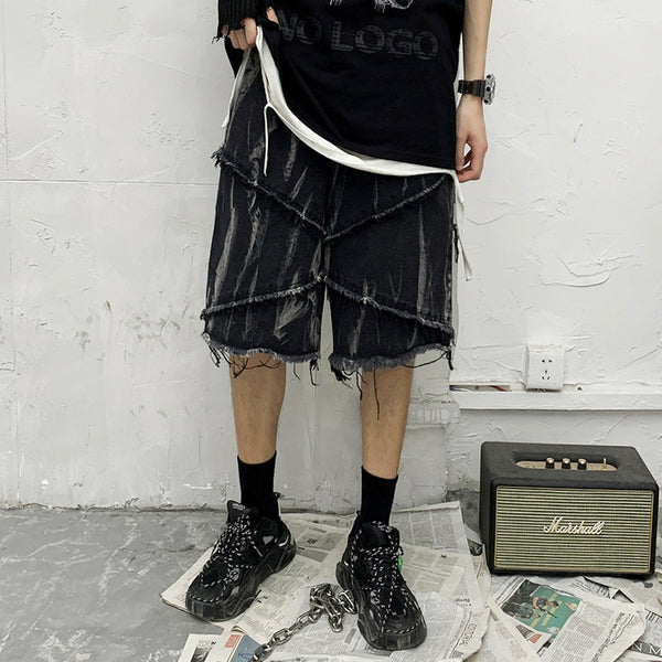 Shorts de Mezclilla Oscura con Estampado Tie-Dye y Bordes Deshilachados