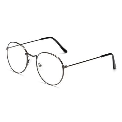 Retro oval anti-blue light glasses with a dark metal frame and clear lenses on a white background. - Image 4