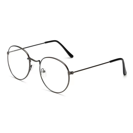 Retro oval anti-blue light glasses with a dark metal frame and clear lenses on a white background. - Image 4