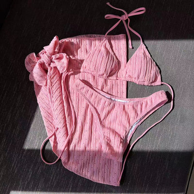 White textured bikini with ruched triangle top, high-cut bottom, and matching sarong with a large bow. - Image 11