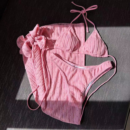 White textured bikini with ruched triangle top, high-cut bottom, and matching sarong with a large bow. - Image 11