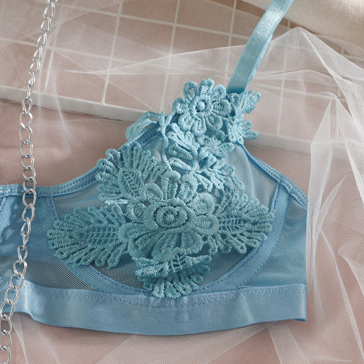 Light blue lace lingerie set with floral details, including a bra, thong, garter belt, choker, and leg chains. - Image 17