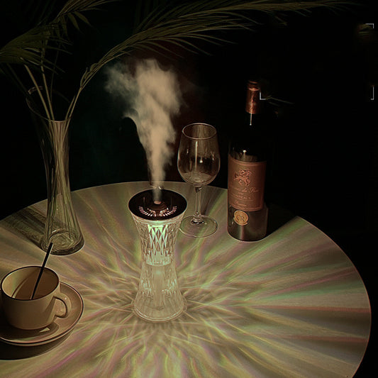 Rose gold and clear crystal-like desktop humidifier with a faceted body and an atmosphere lamp function.