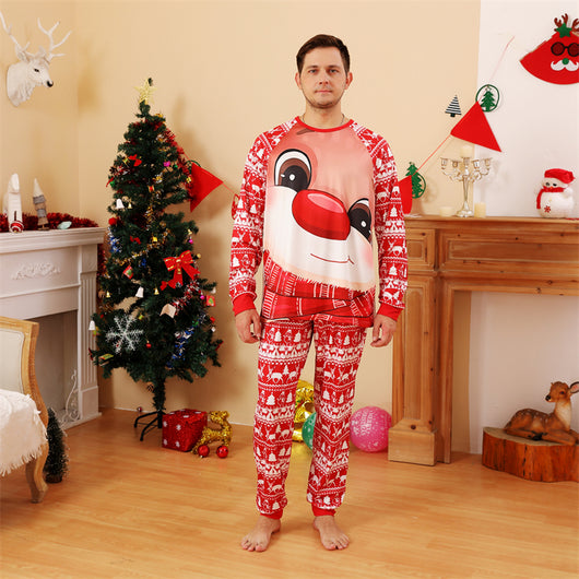 Baby wearing a red and white Christmas pajama set with a fawn graphic, sitting on a white blanket. - Image 15