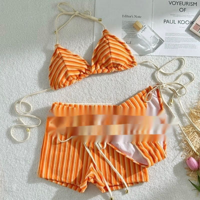 Orange and light orange striped bikini bottom with a ribbed texture and elastic waistband, ideal for beach vacations. - Image 2