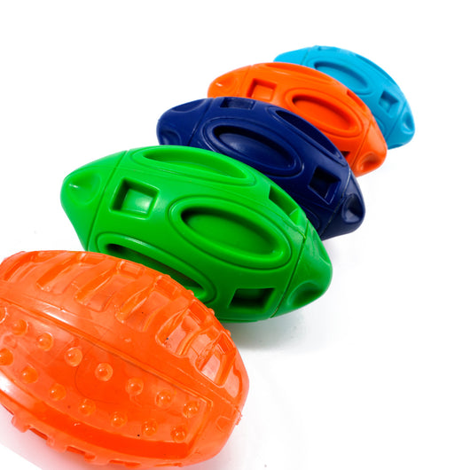 Orange rubber dog toy shaped like a rugby ball with hollowed-out sections, designed for wear-resistant chewing. - Image 7