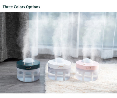 White portable projection humidifier with a translucent water tank and gold-accented control buttons. - Image 16