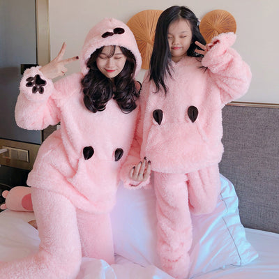 Mother and child wearing matching brown plush bear pajamas with hoods, ears, and embroidered paw gloves. - Image 3