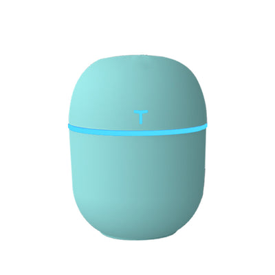 Teal egg-shaped USB humidifier with a glowing blue light band and a 'T' shaped indicator on top. - Image 10