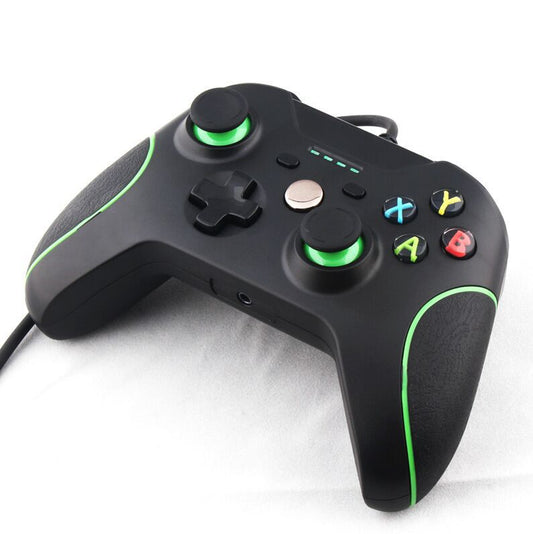 Black wired USB game controller with green accents, two joysticks, and ABXY buttons, shown with USB, USB-C, and micro-USB adapters.