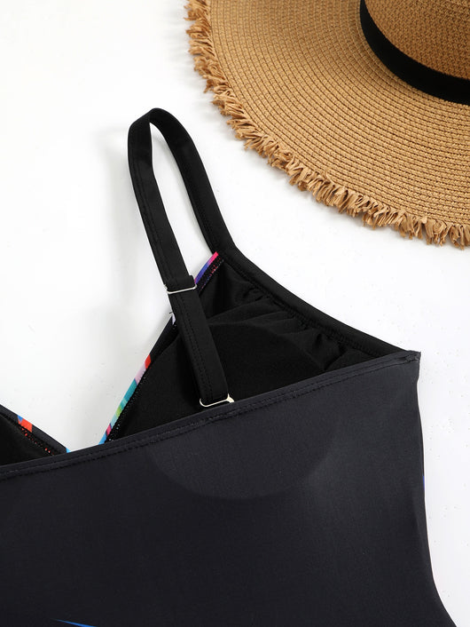 Woman in a navy and white striped tankini swimsuit with a wrap-front and side drawstring, holding a woven bag. - Image 19