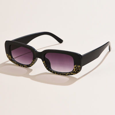 Rectangular tortoiseshell sunglasses with a small frame and dark gray lenses, angled on a white background. - Image 23