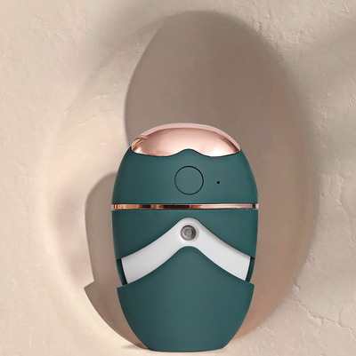 White and rose gold eye protector mini spray and conditioner atomizing device with a smooth, ergonomic design. - Image 6