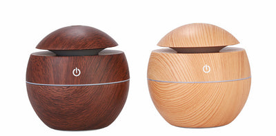Dark wood grain aroma diffuser and humidifier with a silver power button and accent line. - Image 16