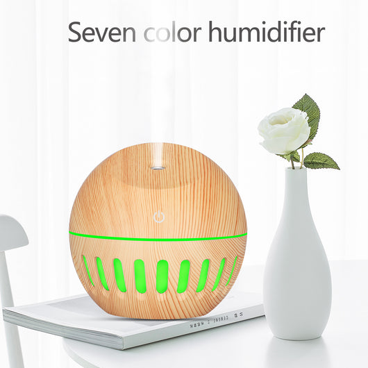White portable home office humidifier with a spherical base, dome top, and glowing blue LED light accents. - Image 4