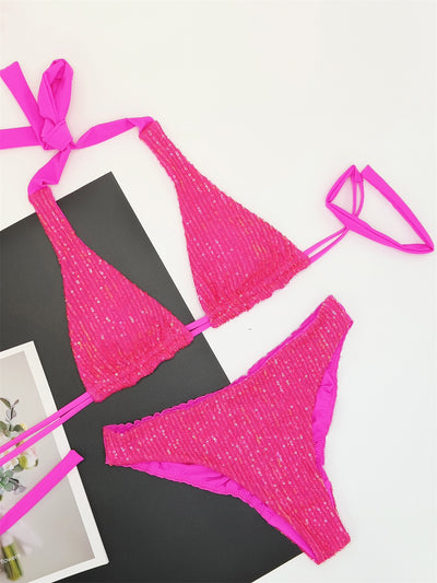 Pink and yellow sequined halter bikini top and high-cut bottoms on a model against a clear blue sky. - Image 15