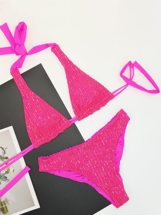 Pink and yellow sequined halter bikini top and high-cut bottoms on a model against a clear blue sky. - Image 15