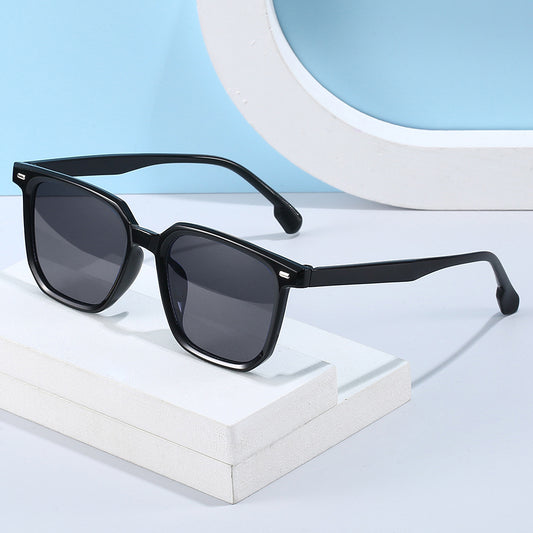Large frame square sunglasses with a transparent champagne-colored frame and brown lenses.