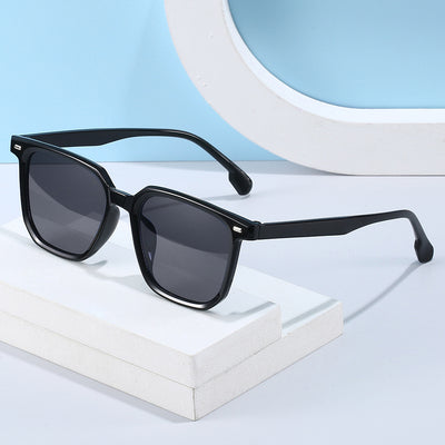Large frame square sunglasses with a transparent champagne-colored frame and brown lenses.