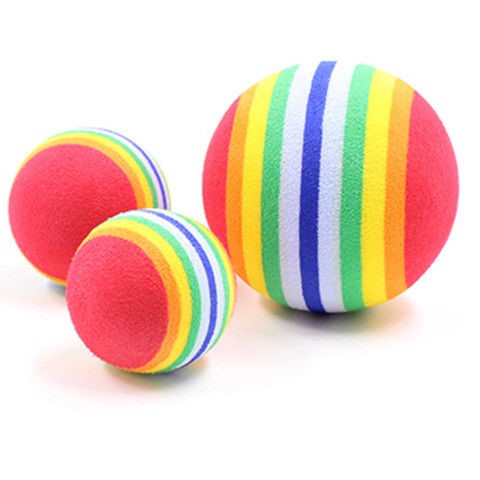 Set of three red pet play balls with rainbow stripes in varying sizes, made from soft EVA material. - Image 2