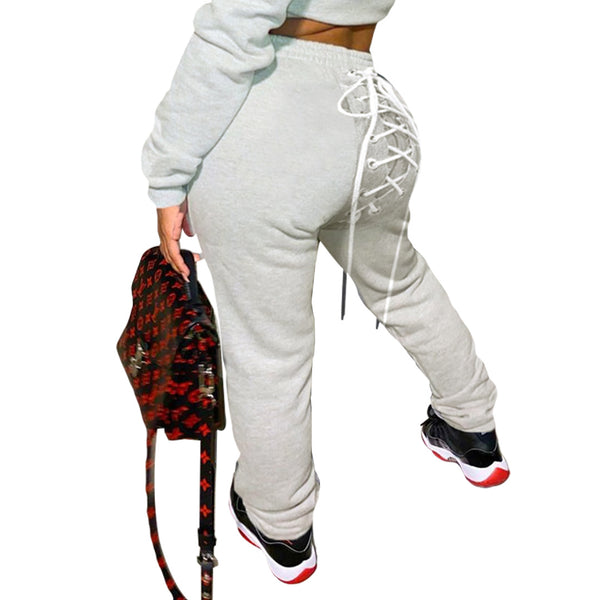 Conjunto de Buzo y Pantalón Deportivo con Ojetes de Color Sólido