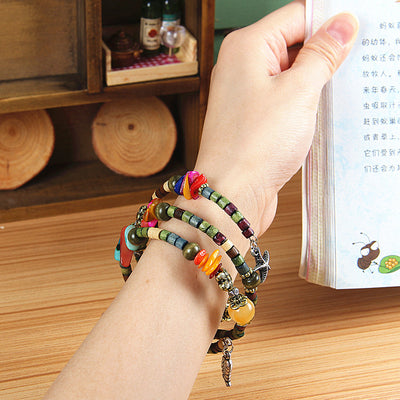 Pulsera de Madera Vintage con Cuentas Budistas y Detalles en Concha - Image 2