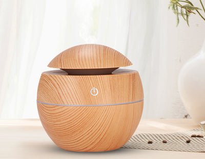 Dark wood grain aroma diffuser and humidifier with a silver power button and accent line. - Image 6