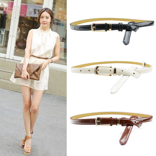 White patent leather women's belt with a slim strap and a gold-tone rectangular pin buckle.