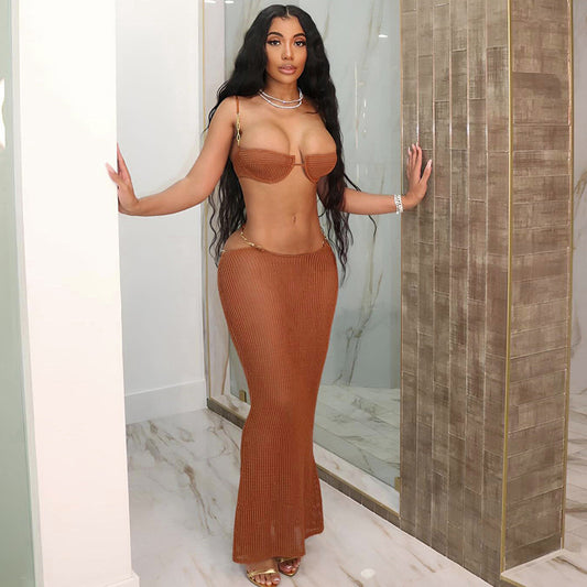 White see-through bikini skirt suit with a mesh bralette top and sheer knit maxi skirt with gold chain details.