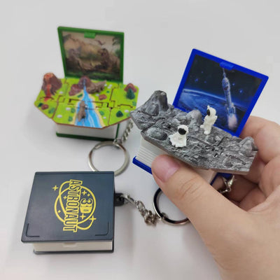 Llavero Libro Emergente 3D Dinosaurio - Juguete Antiestrés Infantil