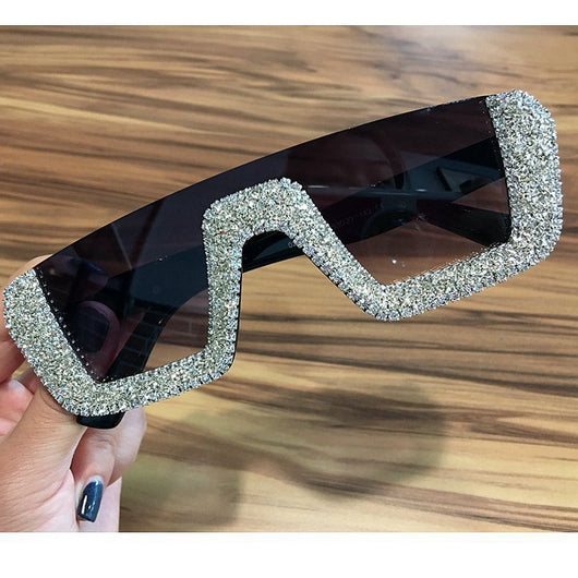 Black square sunglasses with a wavy top frame embellished with brown and clear rhinestones and gradient smoke lenses. - Image 8