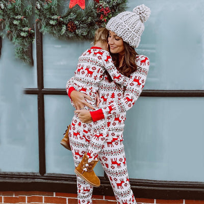 Mother and two daughters in matching red and white elk print long-sleeve pajamas, perfect for holiday family photos. - Image 4